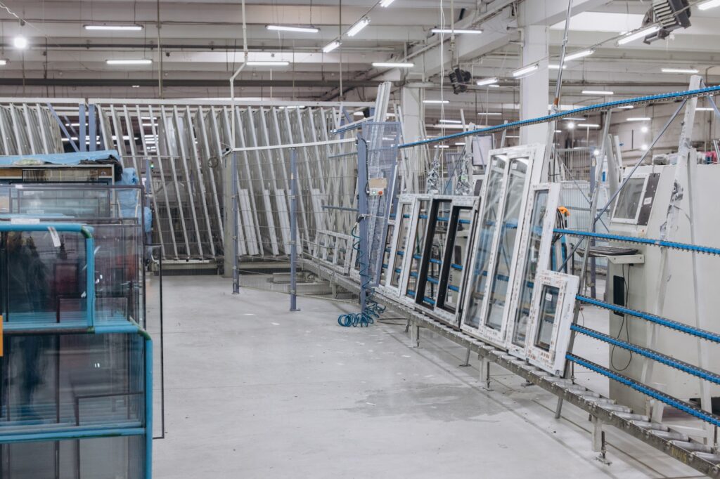 Pvc windows and doors moving on production line in a factory